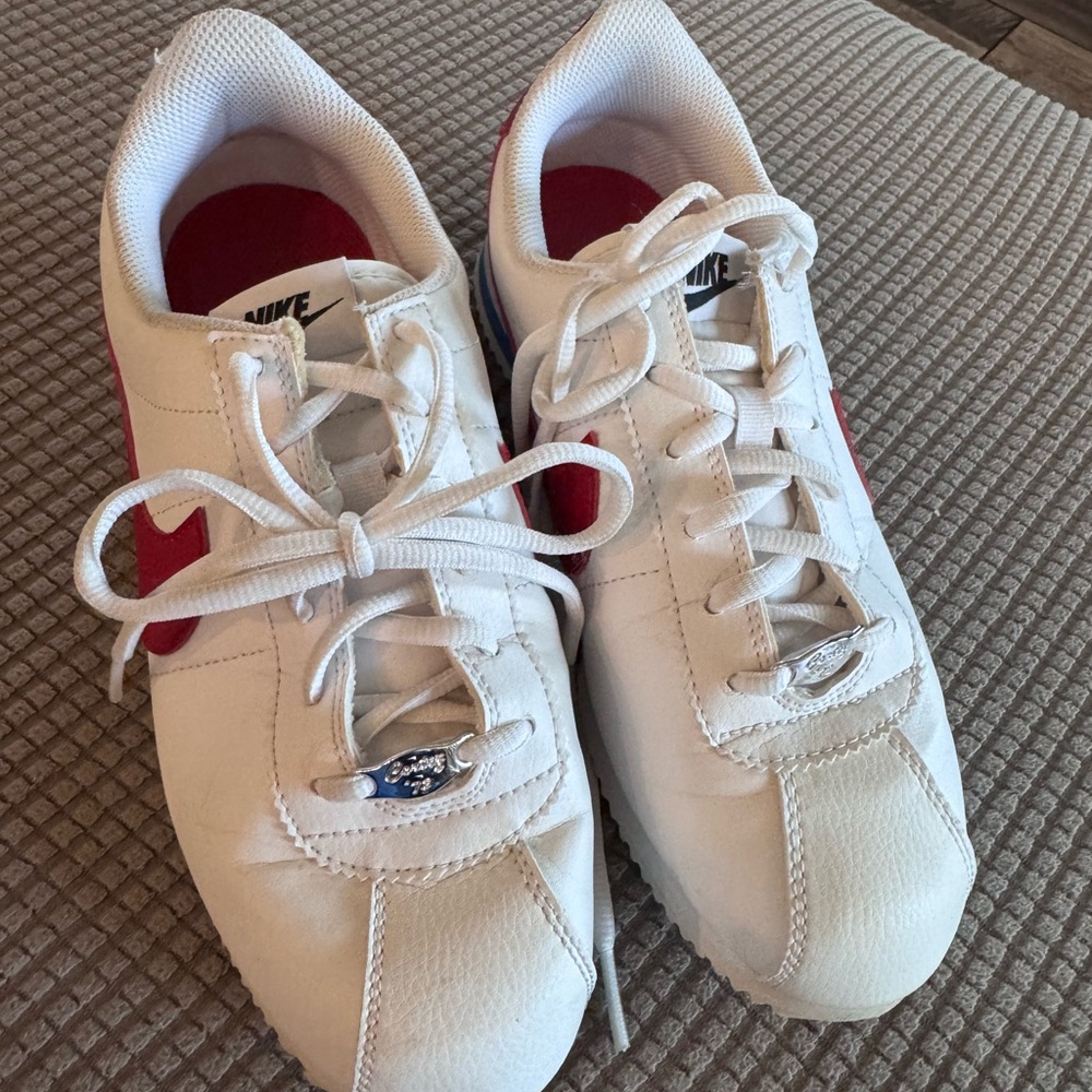 Nike White Sneakers with Red Swoosh Accents